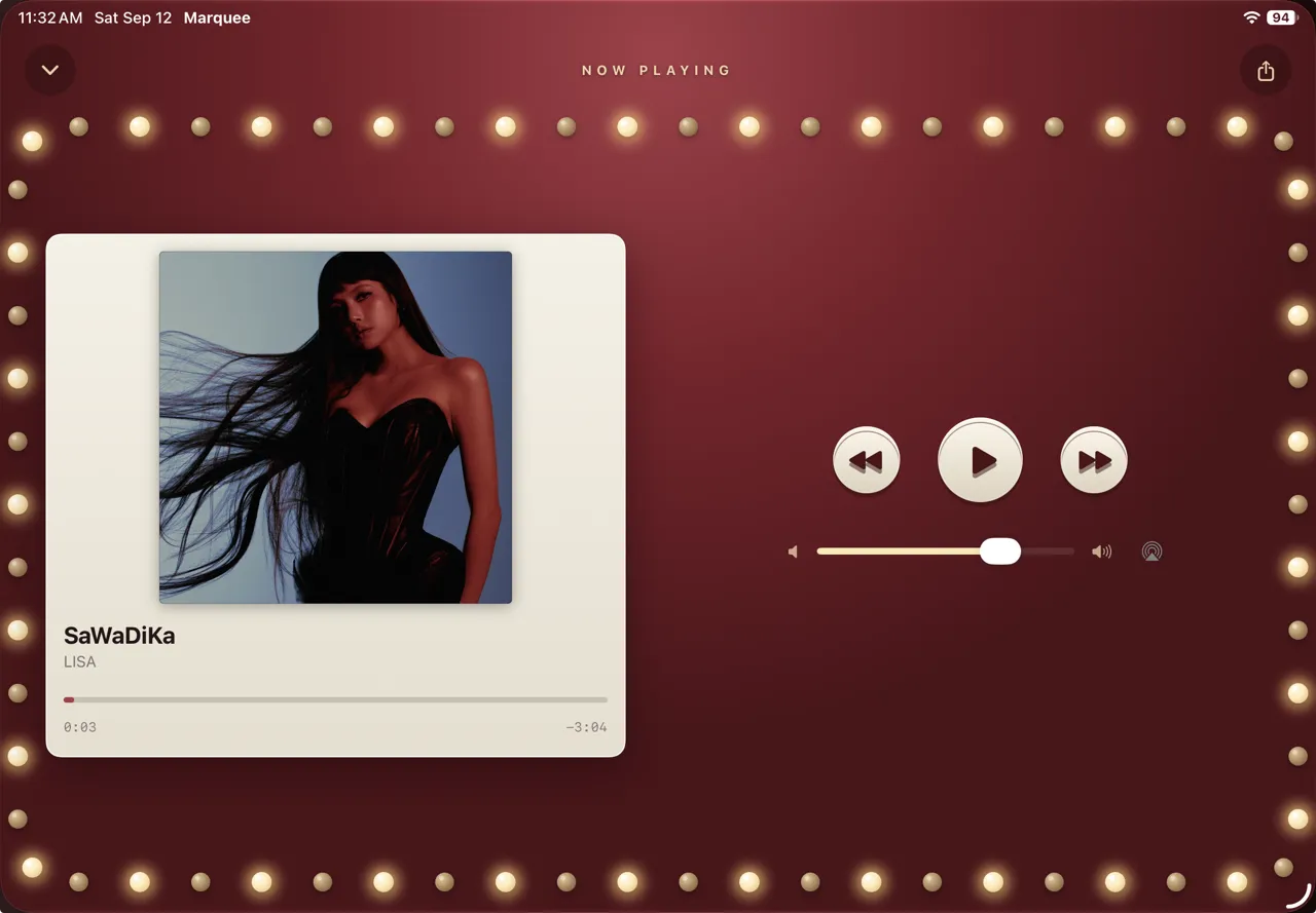 Marquee player style on iPad in landscape: the album ticket card on the left, play and skip controls with a volume slider on the right, ringed by golden marquee bulbs