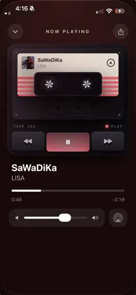 Marquee Cassette player style playing an Apple Music song on a tape deck with winding spools