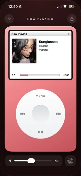 Marquee Retro player style in a pink theme, with Apple Music album art on a glossy screen above a white wheel with Menu, skip, and play/pause controls